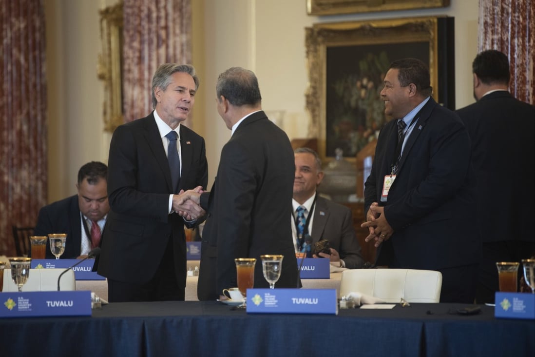 Secretary of State Antony Blinken, left, greets dignitaries from Pacific island countries. Photo: AP