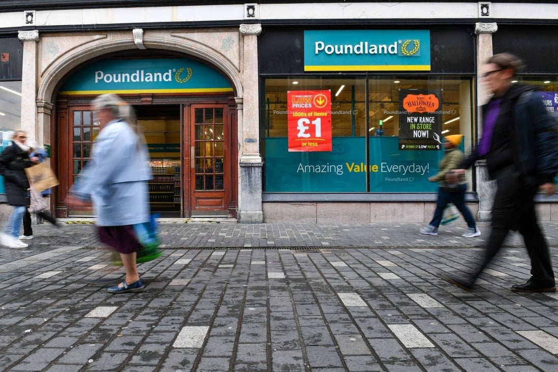 Pedestrians pass a pound store in Liverpool. Photo: Bloomberg