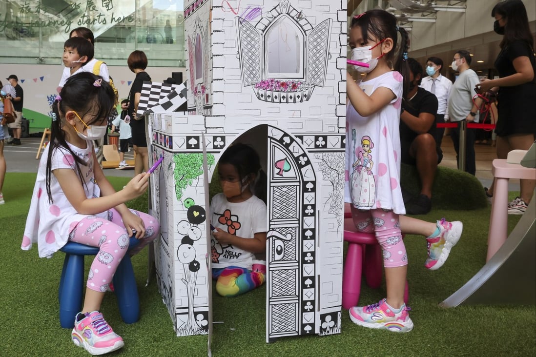 Children draw on a model house at a mall in Lok Fu on October 2. Photo: Edmond So