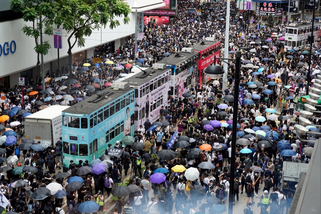 Protesters gather near Sogo department store in Causeway Bay for a march between Causeway Bay and Wan Chai on May 24, 2020. Photo: Robert Ng