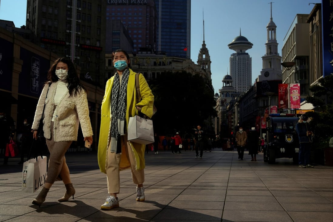 Shoppers in Shanghai on December 1, 2021. China must engineer a surge in consumption growth so it replaces investment growth as a driver of GDP, but past experience shows just how difficult this is. Photo: Reuters