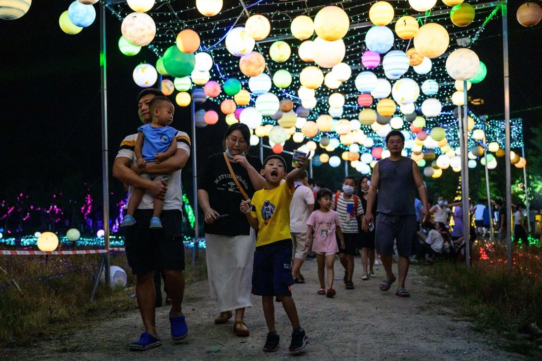 Families visit a lantern show in Guangzhou in China’s southern Guangdong province. where Cantonese is commonly spoken. Photo: AFP