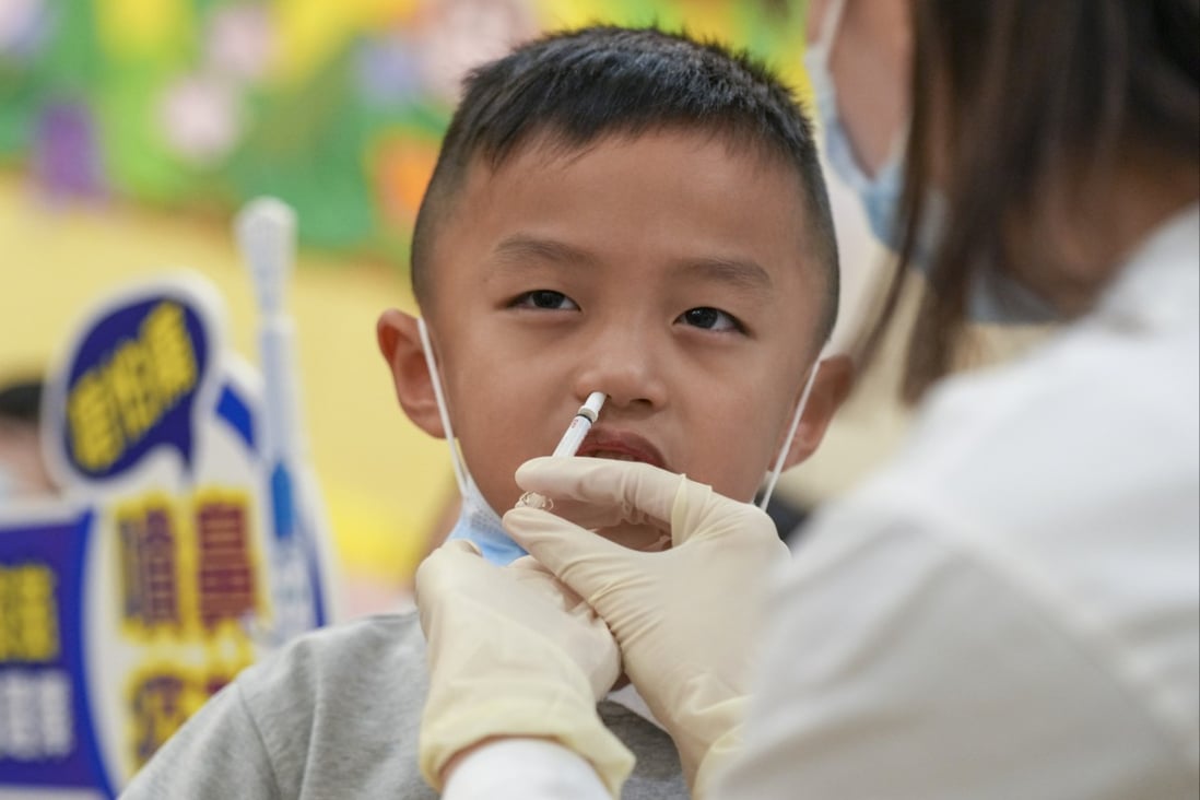 A child receives a nasal spray flu vaccine at Five District Business Welfare Association Cheung Chuk Shan Kindergarten on September 25. Photo: Sam Tsang