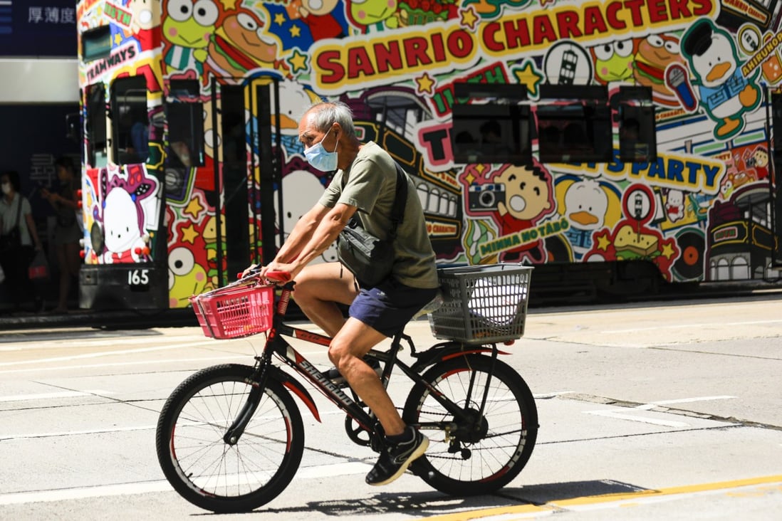 An elderly Hongkonger rides through Causeway Bay on September 15. Photo: Xiaomei Chen