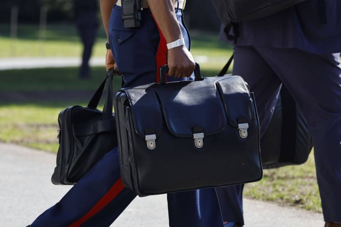 A military aide carries the ‘nuclear football’, as he follows US President Joe Biden, not pictured, onto Marine One. Photo: Bloomberg