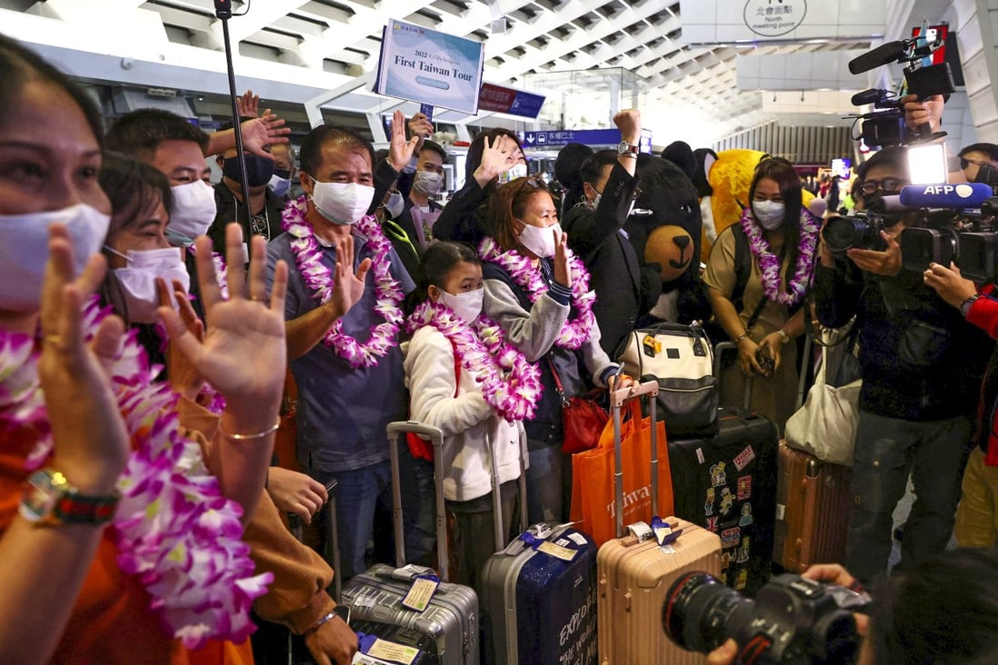 Flowers and mascots greet travellers from Thailand as they arrive on the first quarantine-free flight to Taiwan since the coronavirus pandemic began in 2020. Photo: Reuters 