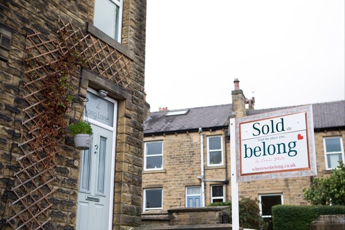 An estate agent’s sign outside a sold property in Holmfirth on September 29. The fall in the value of the pound has resulted in banks withdrawing mortgage deals, with interest rates expected to rise further. Photo: EPA-EFE