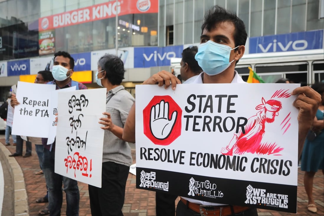 Anti-government protesters hold placards during a protest against the current economic and political crisis, in Colombo, Sri Lanka earlier this month. Photo: EPA-EFE