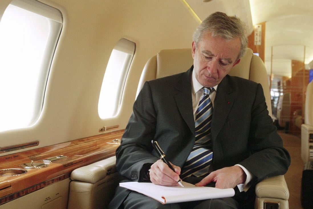 LVMH’s Bernard Arnault on board the group’s private jet. He recently revealed it had sold the plane to stop Twitter accounts from posting about his travels. Photo: Getty Images