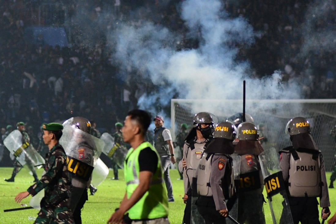 Indonesian police at the doomed football match at the Kanjuruhan stadium in East Java on October 1. Photo: AFP