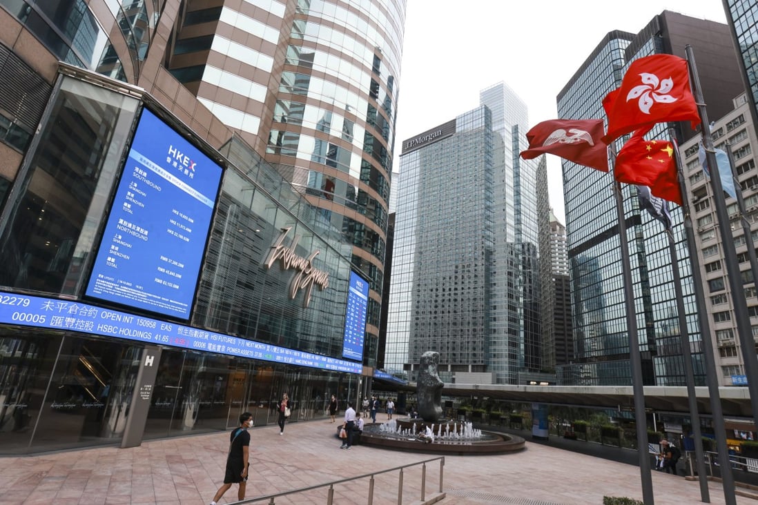 An electronic board displays the latest stock transactions outside Exchange Square in Central, Hong Kong. Photo: May Tse