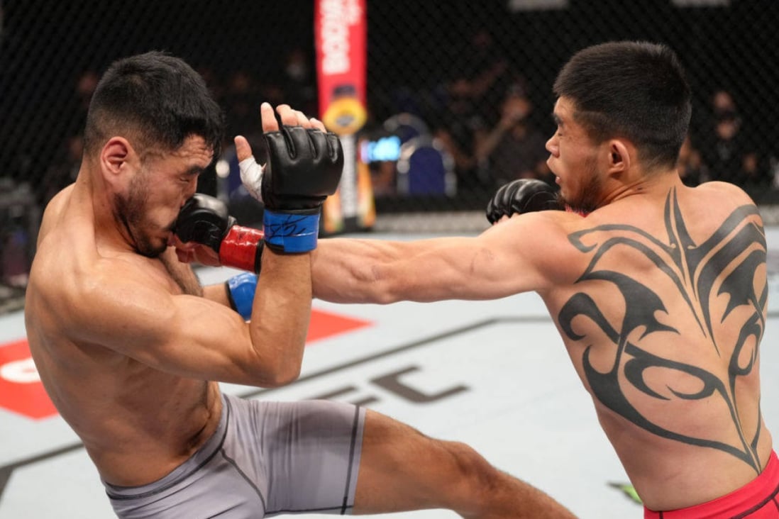 Lu Kai lands a punch on Angga during their featherweight bout in Singapore. Photo: UFC