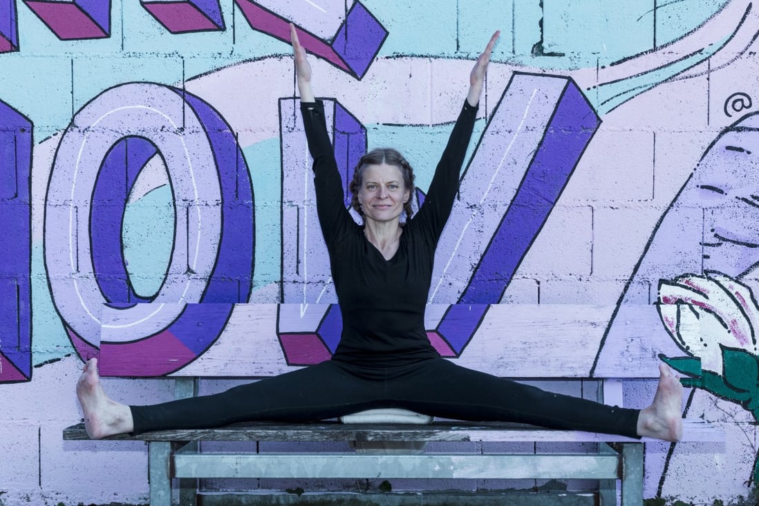 Petra Winkler-Hirter in upavishtha konasana pose, in Germany, in 2022. Iyengar yoga helped the former massage therapist through chemotherapy’s side effects and recover from breast cancer. Photo: Courtesy of Petra Winkler-Hirter