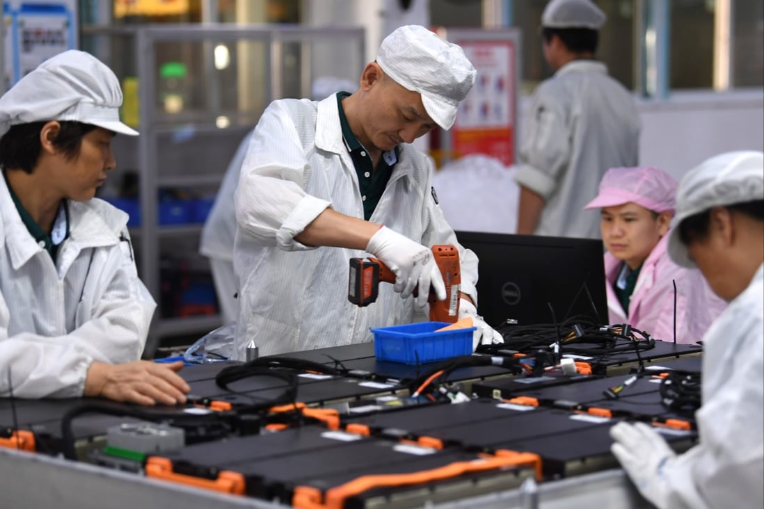Workers work on a power battery production line at a workshop of a battery production company in Hefei Economic and Technological Development Area in Hefei, east China’s Anhui province. Photo: Xinhua