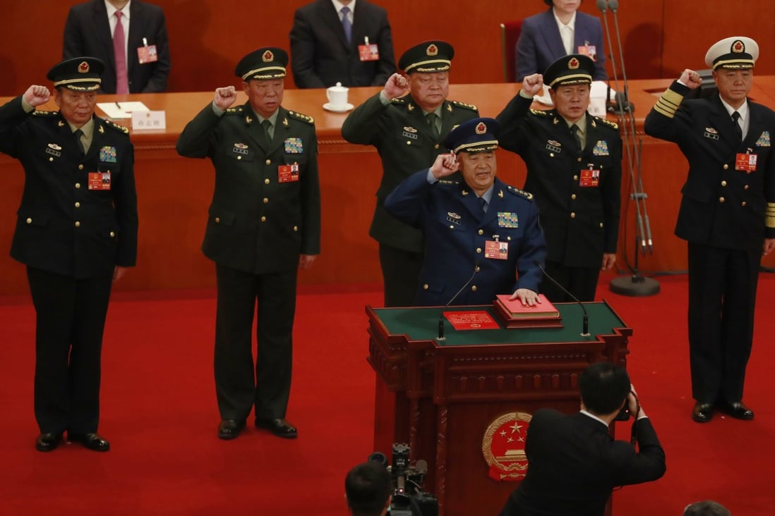 Then newly elected vice chairmen of the Central Military Commission,  Xu Qiliang (foreground) and Zhang Youxia (third left) with CMC members (from left) Zhang Shengmin, Li Zuocheng, Wei Fenghe and Miao Hua swear an oath on the constitution  at the Great Hall of the People in Beijing in March 2018. Photo: EPA-EFE 