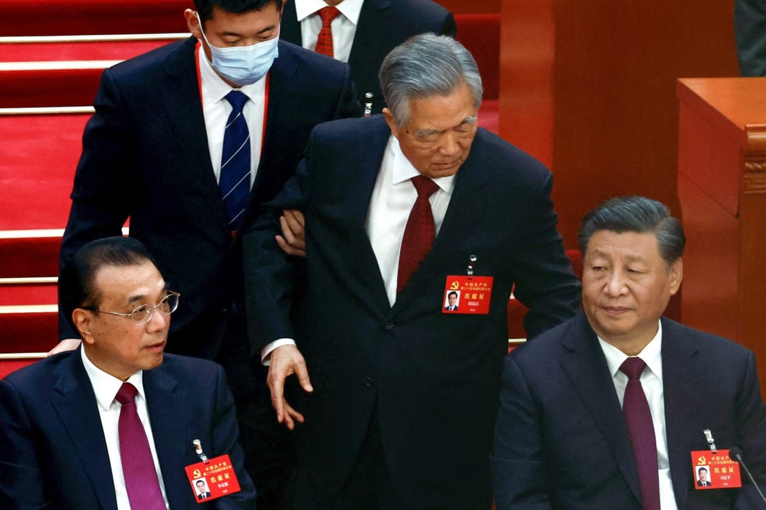 Former Chinese president Hu Jintao leaves his seat next to Chinese President Xi Jinping and Premier Li Keqiang, during the closing ceremony of the congress on Sunday. Photo: Reuters