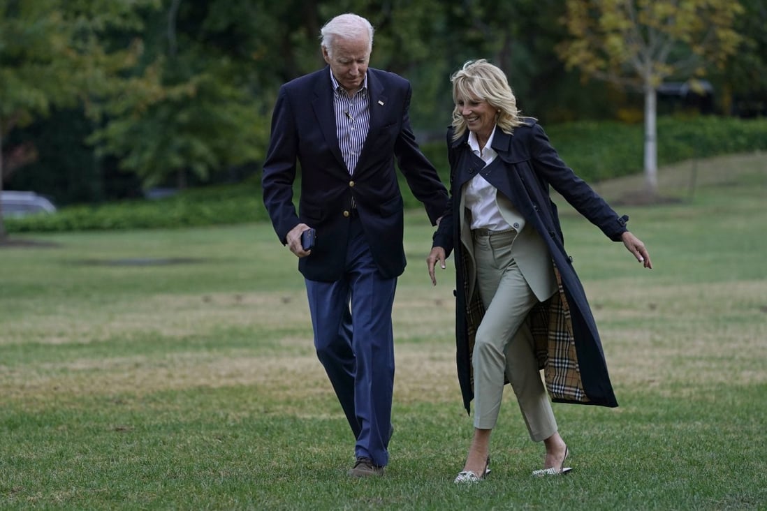President Joe Biden and first lady Jill Biden walk across the South Lawn of the White House in Washington. Photo: AP
