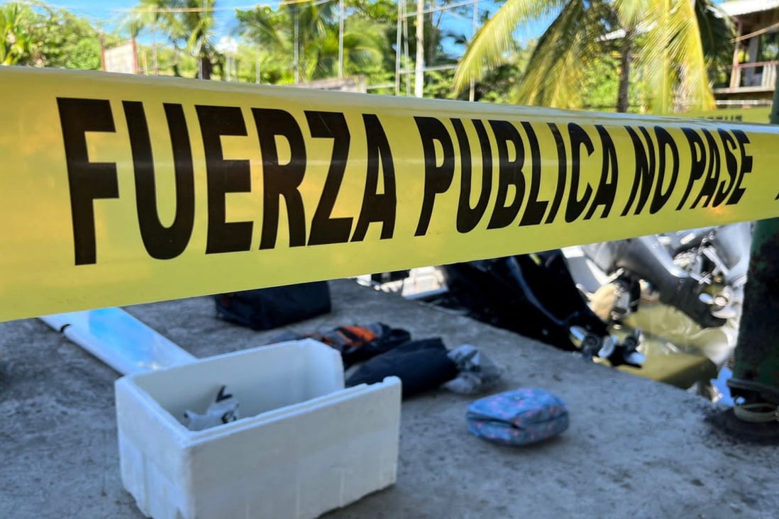 A police cordon next to the remains of a plane and personal belongings at Limon airport, Costa Rica on Saturday. Photo: Ministry of Security / Handout via Reuters