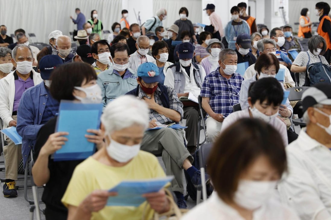 People at a vaccination centre in Kobe, western Japan, in 2021. A high number of elderly people is part of the reason why there is a shortage of healthcare workers. Photo: Kyodo