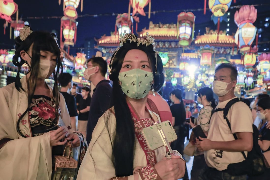 People wear traditional dress and hold colourful lanterns in celebration of the Mid-Autumn Festival at Sik Sik Yuen’s Lantern Carnival in Wong Tai Sin, Hong Kong, on September 10. Photo: Xiaomei Chen