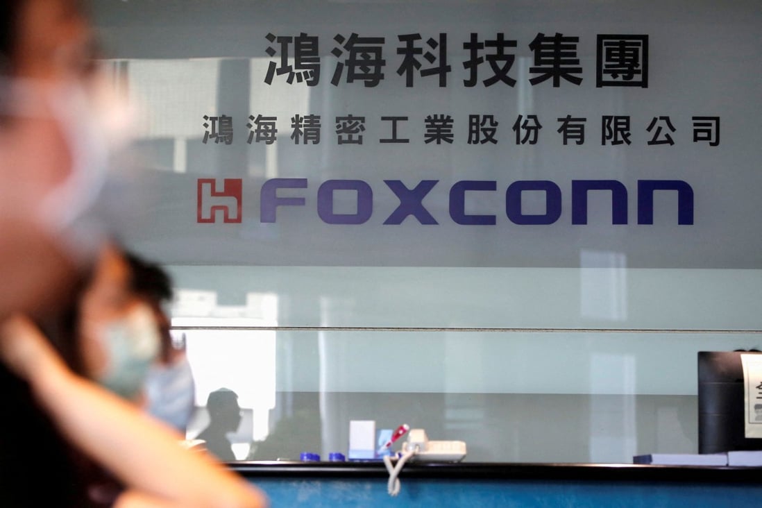 People wear masks to protect themselves from Covid-19 while listening to the annual general meeting at the lobby of Foxconn’s office in Taipei on June 23, 2020. Photo: Reuters