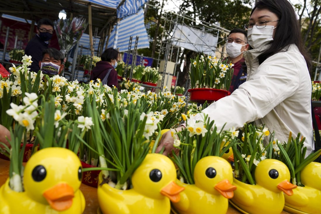 Customers visit the Lunar New Year flower market at Victoria Park in Causeway Bay, amid the Covid-19 crowd-control measures in 2021. Photo: Sam Tsang