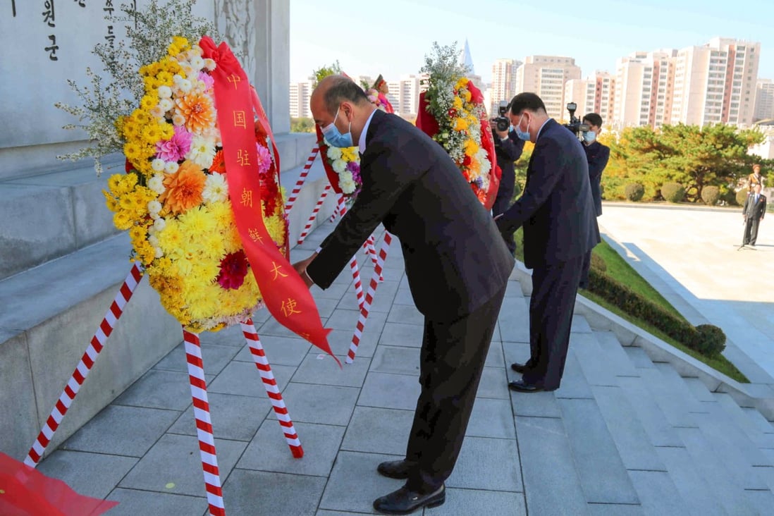 Sun Hongliang, chargé d’affaires of the Chinese embassy, and Kang Yun-seok, vice-chairman of the North Korean legislature’s standing committee, lay flowers at the Friendship Tower in Pyongyang on Tuesday. Photo: Chinese embassy in Pyongyang