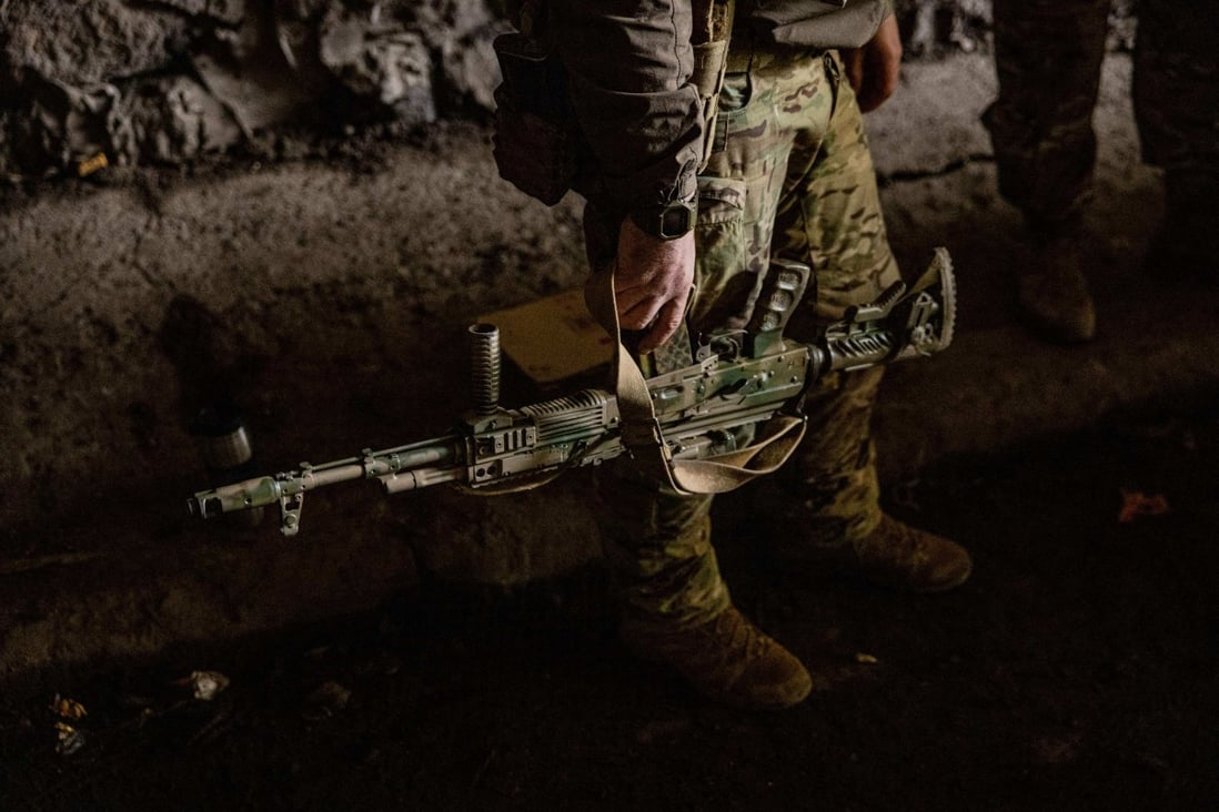 A Ukrainian soldier holds his assault rifle in the town of Bakhmut, in eastern Ukraine’s Donbas region. Photo: AFP