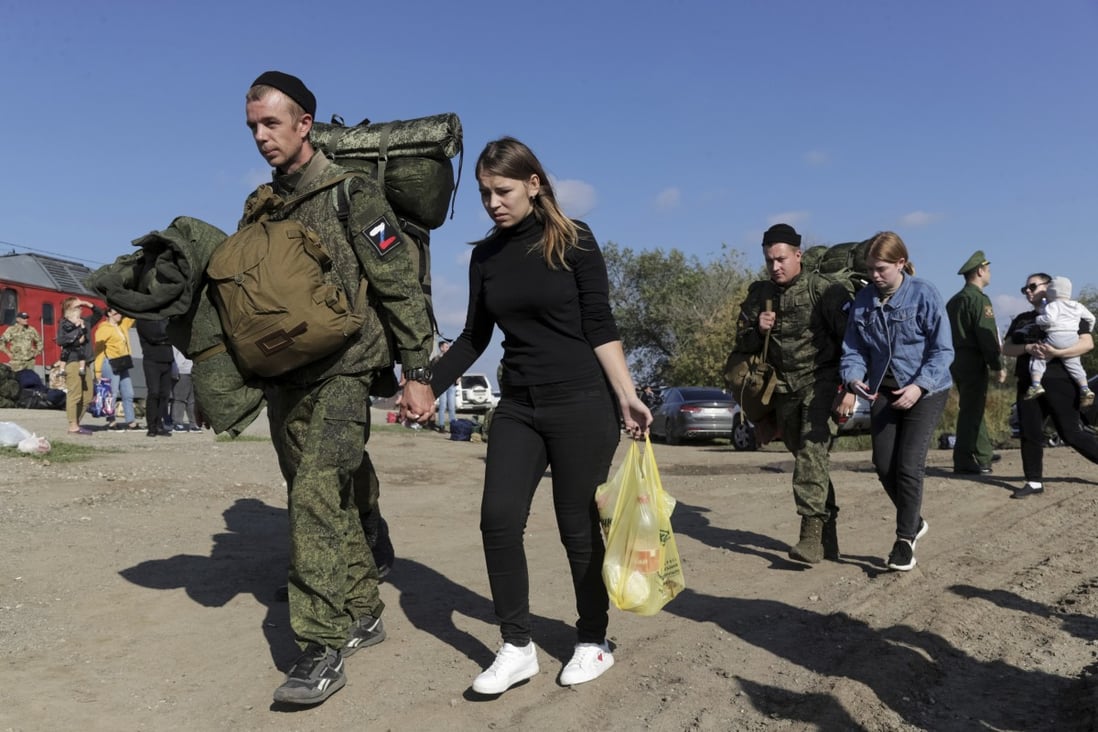 Russian recruits escorted by their wives walk to a train station in Prudboi, in Russia’s Volgograd region, in September. Photo: AP
