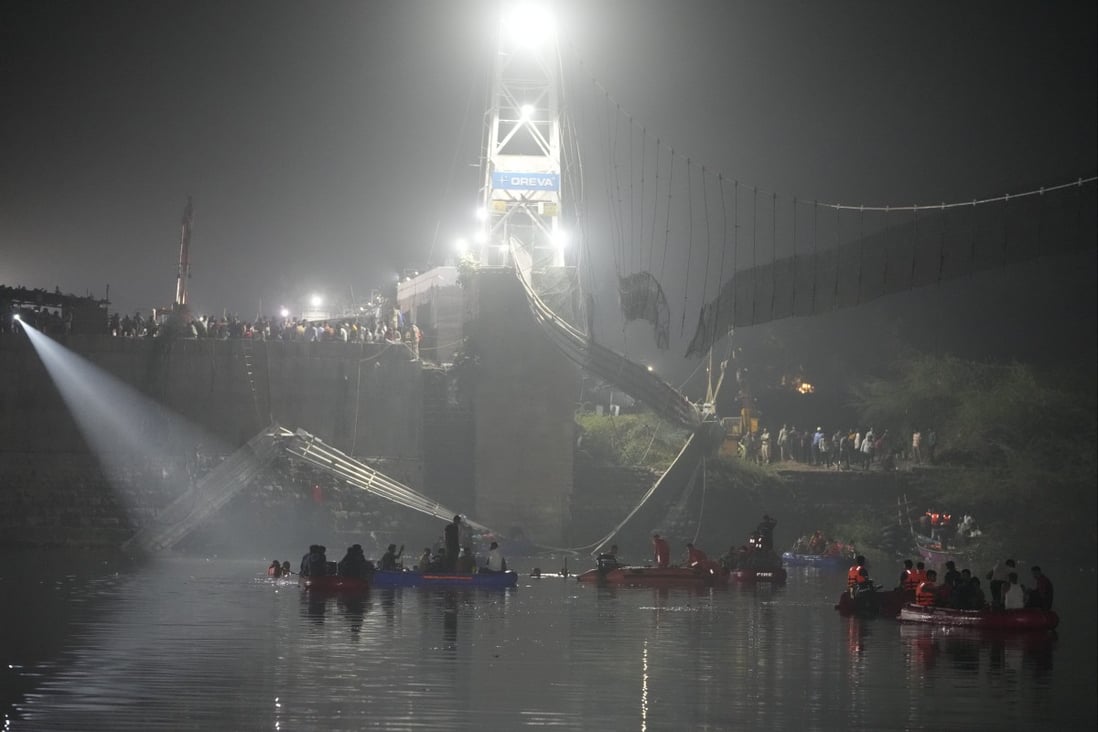 Rescuers in boats search the Machchu river for victims on Monday after a cable suspension bridge collapsed in Morbi, India’s Gujarat state. Photo: AP