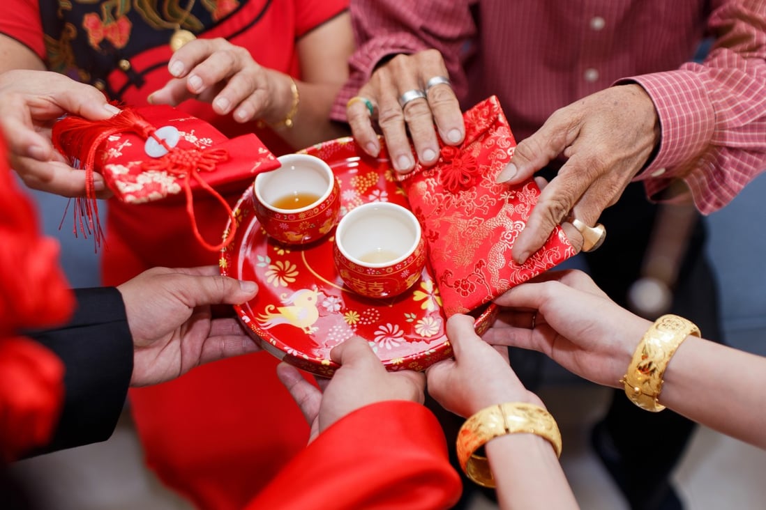 A couple holds lai see from elderly family members during a Chinese wedding. In August, Hong Kong’s Court of Appeal ruled that the city’s mini-constitution granted access to the institution of marriage only to opposite sex partners and that the government had no obligation to recognise same-sex unions. Shutterstock.