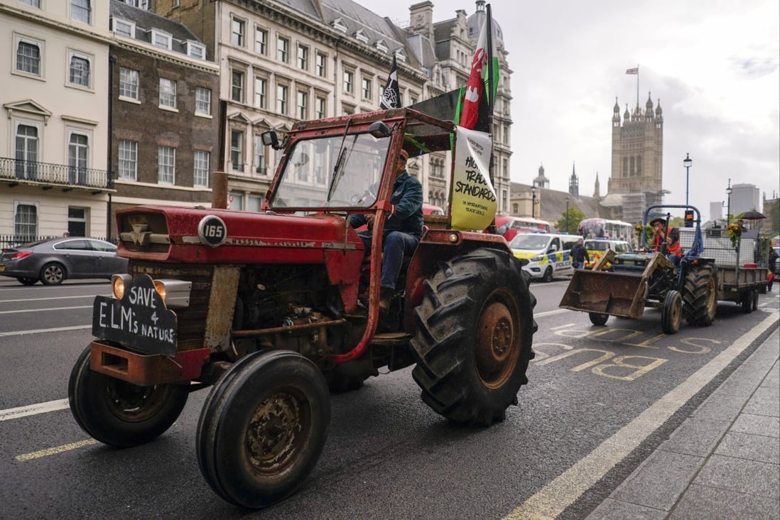 British farmers drive tractors through London during a protest march. Photo: AP