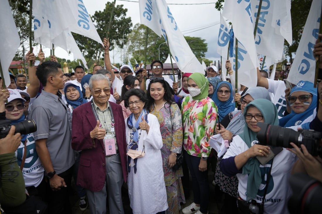 Malaysia’s former prime minister Mahathir Mohamad (centre left) with supporters after filing his nomination in Langkawi on Saturday. Photo: AP
