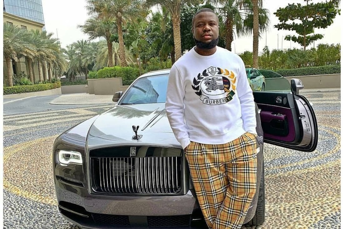 Ramon Abbas – better known as Hushpuppi – frequently posed with luxury cars in designer clothes before he was exposed for money laundering. Photo: @hushpuppi__/Instagram