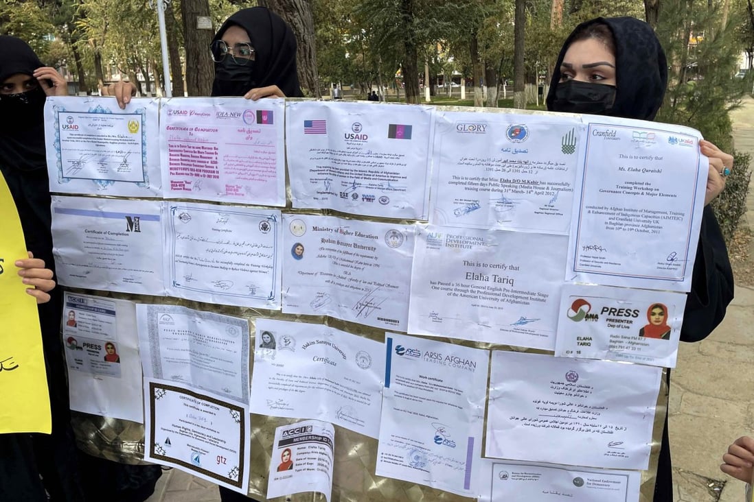Afghan women hold their educational documents during a protest as they demand the Taliban government provide them with job opportunities in Kabul, Afghanistan, on October 31. The Taliban have banned women from many government jobs and forbidden secondary school education for girls.  Photo: EPA-EFE