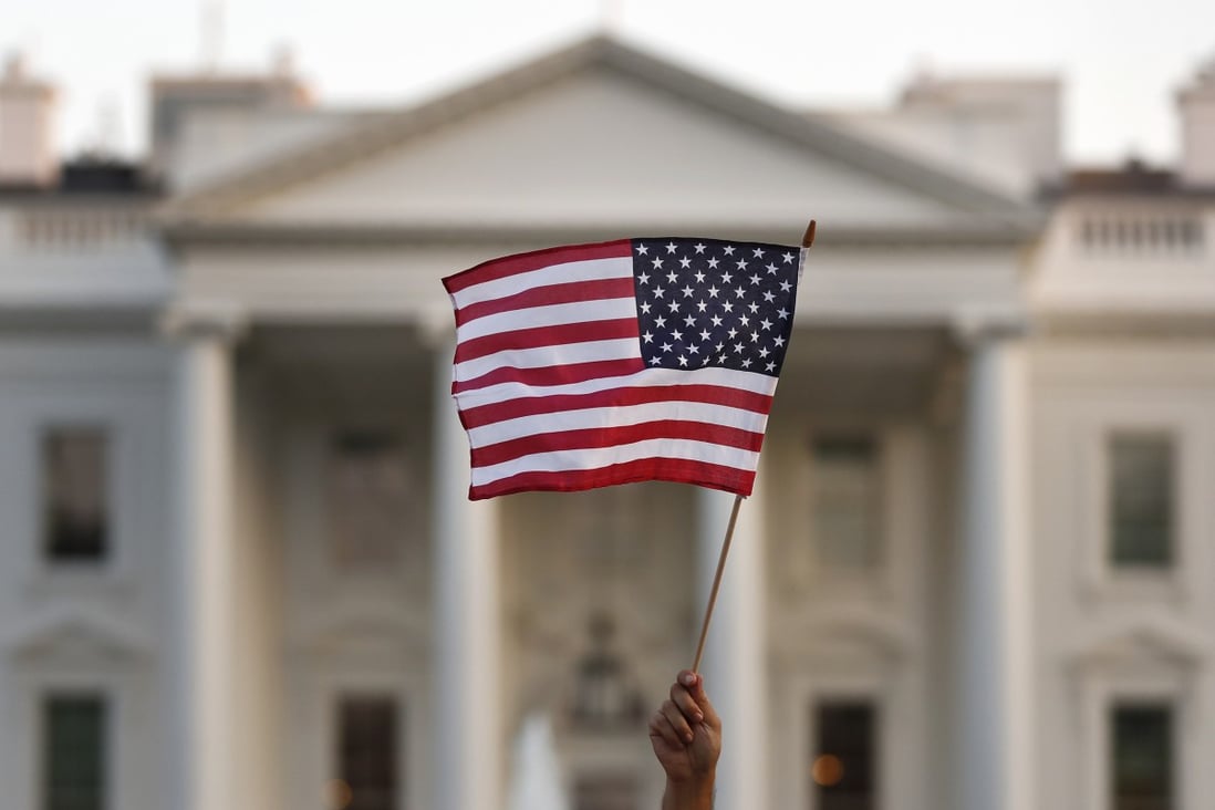 A US flag is waved outside the White House in September 2017. Photo: AP