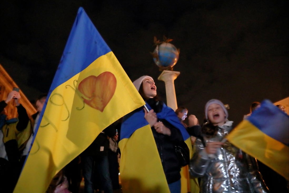 People celebrate in Kyiv on Friday after Russia’s retreat from Kherson. Photo: Reuters