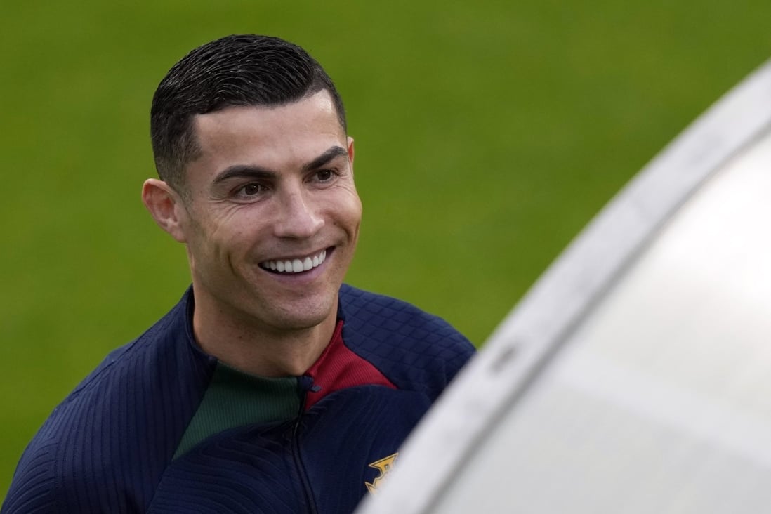 Cristiano Ronaldo smiles as he arrives for a Portugal training session in Oeiras, outside Lisbon. Photo: AP