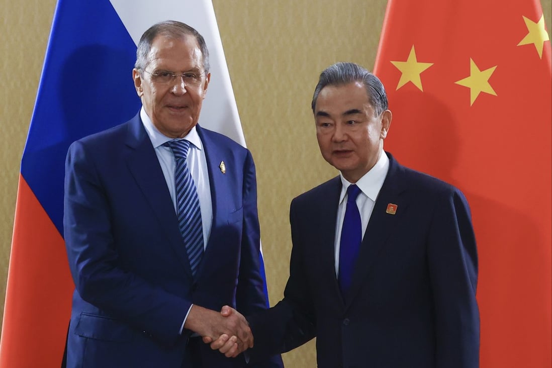 Russian Foreign Minister Sergey Lavrov and his Chinese counterpart Wang Yi ahead of their talks on the sidelines of the G20 summit on Tuesday. Photo: AP