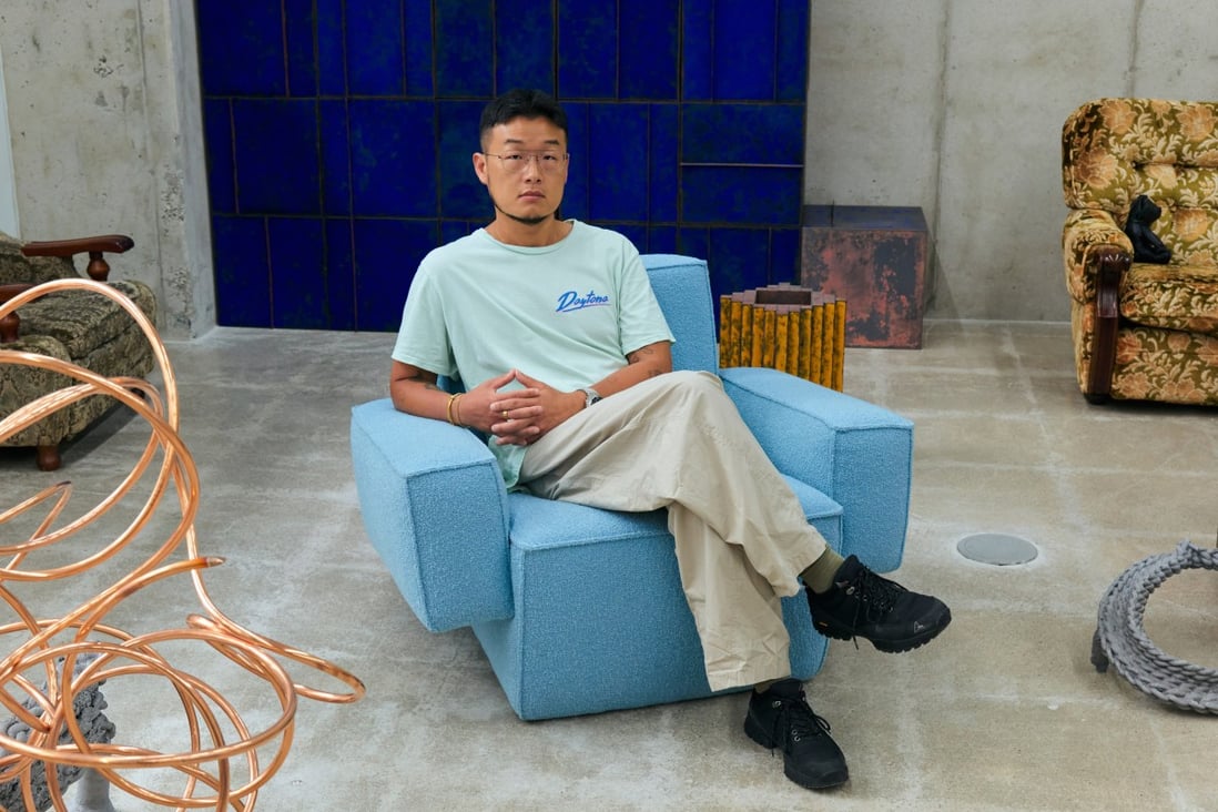 Korean designer Kwangho Lee sits in a lounge chair he made entirely from natural materials - wood, latex foam, cocomat (coconut fibre) and wool. Photo: Jihoon Kang