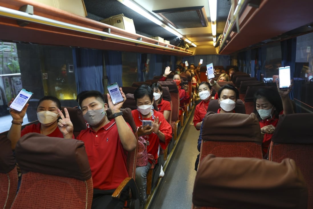 Members of a Thai group tour show their blue health codes during their trip to Hong Kong. Photo: Yik Yeung-man