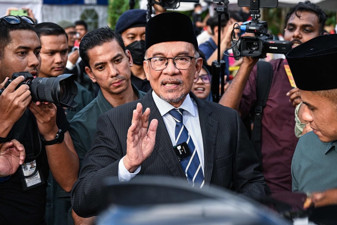 Anwar Ibrahim leaves after meeting Malaysia’s king at the National Palace on Tuesday. Photo: AFP 