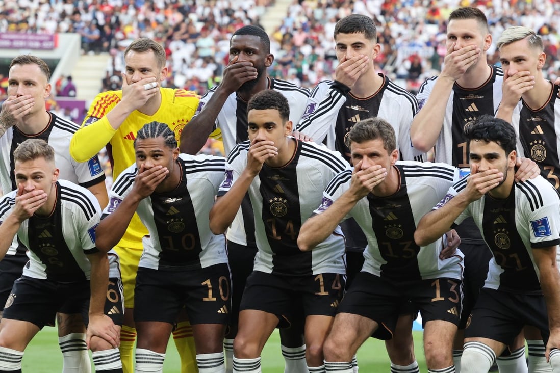 Germany players cover their mouths as they pose for the team photo before the start of the Fifa World Cup Qatar 2022 Group E match against Japan at Khalifa International Stadium. Photo: dpa