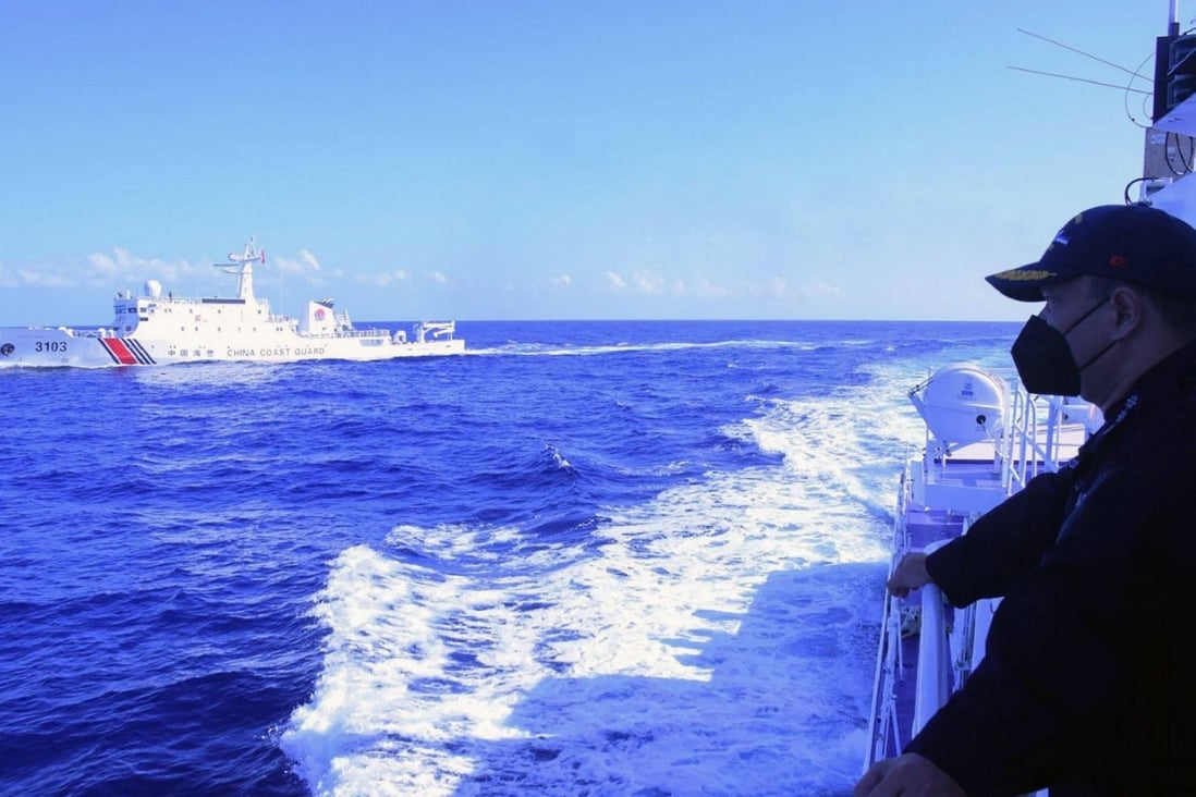 Philippine coast guard personnel monitor a Chinese coast guard ship in Scarborough Shoal in the South China sea. Photo: Philippine Coast Guard/Handout/AFP/ File