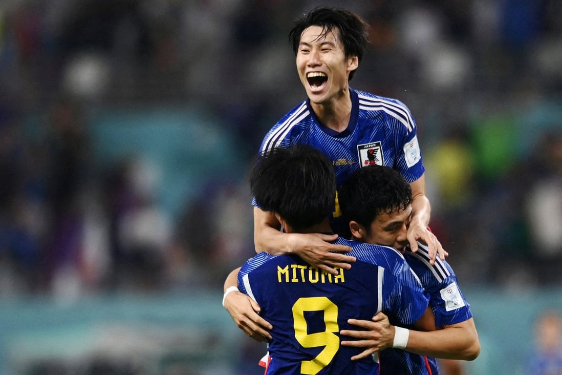 Japan’s Kaoru Mitoma, Wataru Endo and Daichi Kamada celebrate after beating Germany. Photo: Reuters