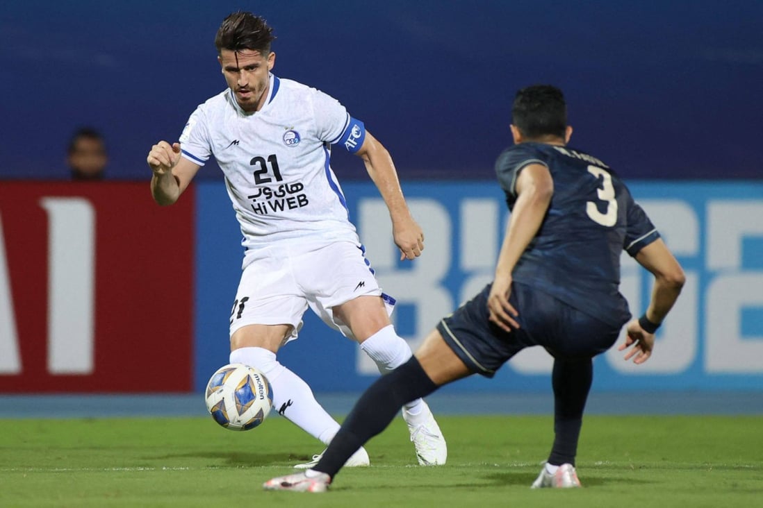 Esteghlal’s defender Voria Ghafouri (left) is marked by Ahli’s defender Mohammed al-Fatil during the AFC Champions League group C match between Saudi Arabia’s Al-Ahli and Iran’s Esteghlal in Jeddah, Saudi Arabia in April 2021. Photo: AFP