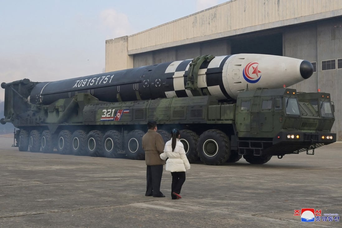 North Korean leader Kim Jong-un, along with his daughter, inspects an intercontinental ballistic missile (ICBM) on November 19. Photo: KCNA via Reuters