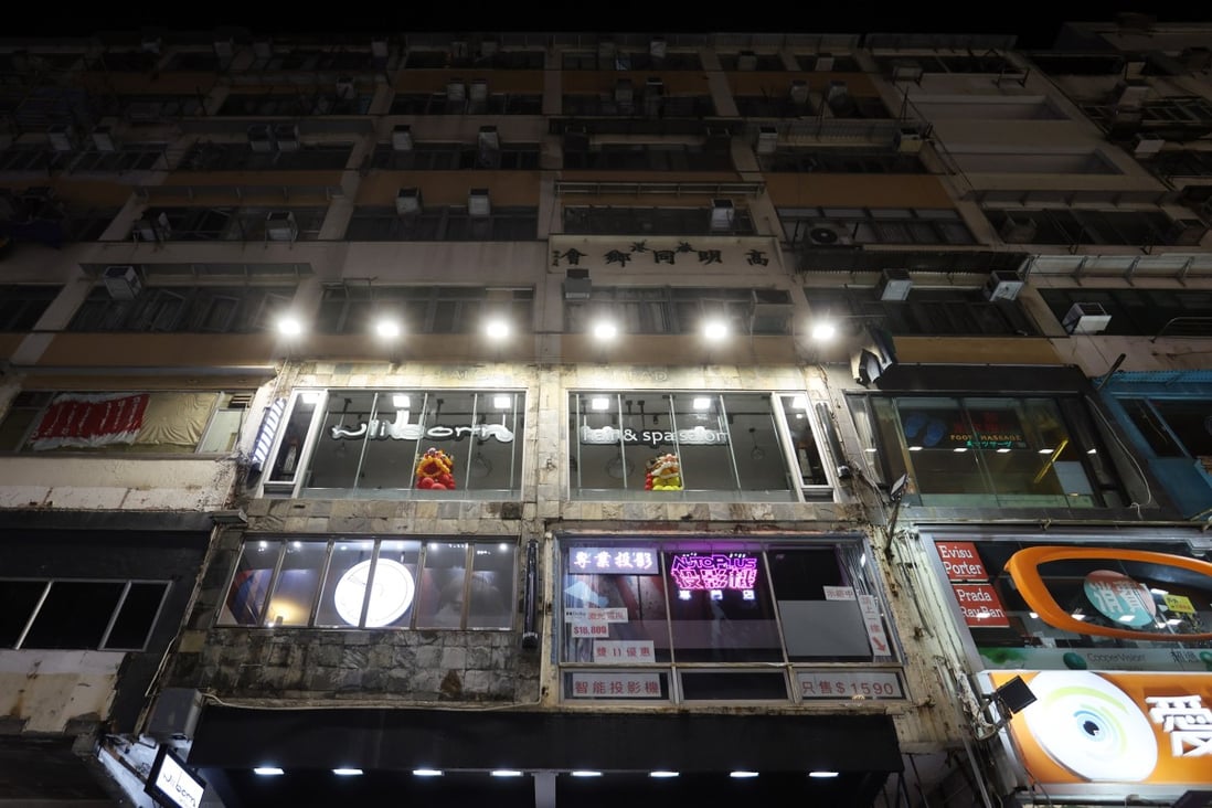 Advertising spotlights illuminate a block in Hong Kong. Photo: Edmond So