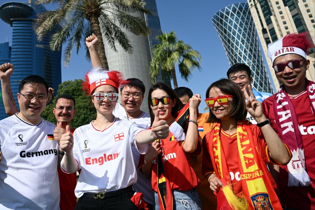 Chinese fans line up for a group photo in Doha. Photo: DPA