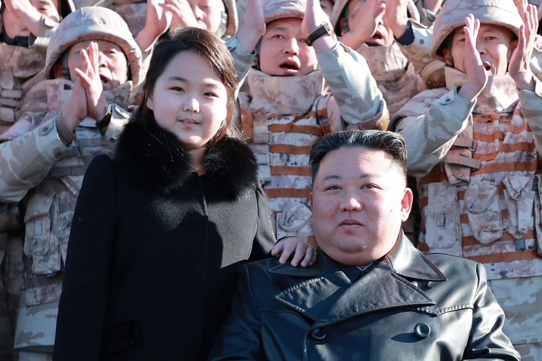 North Korean leader Kim Jong-un posing with his daughter, presumed to be his second child, Ju-ae, during a missile test. Photo: EPA-EFE/KCNA
